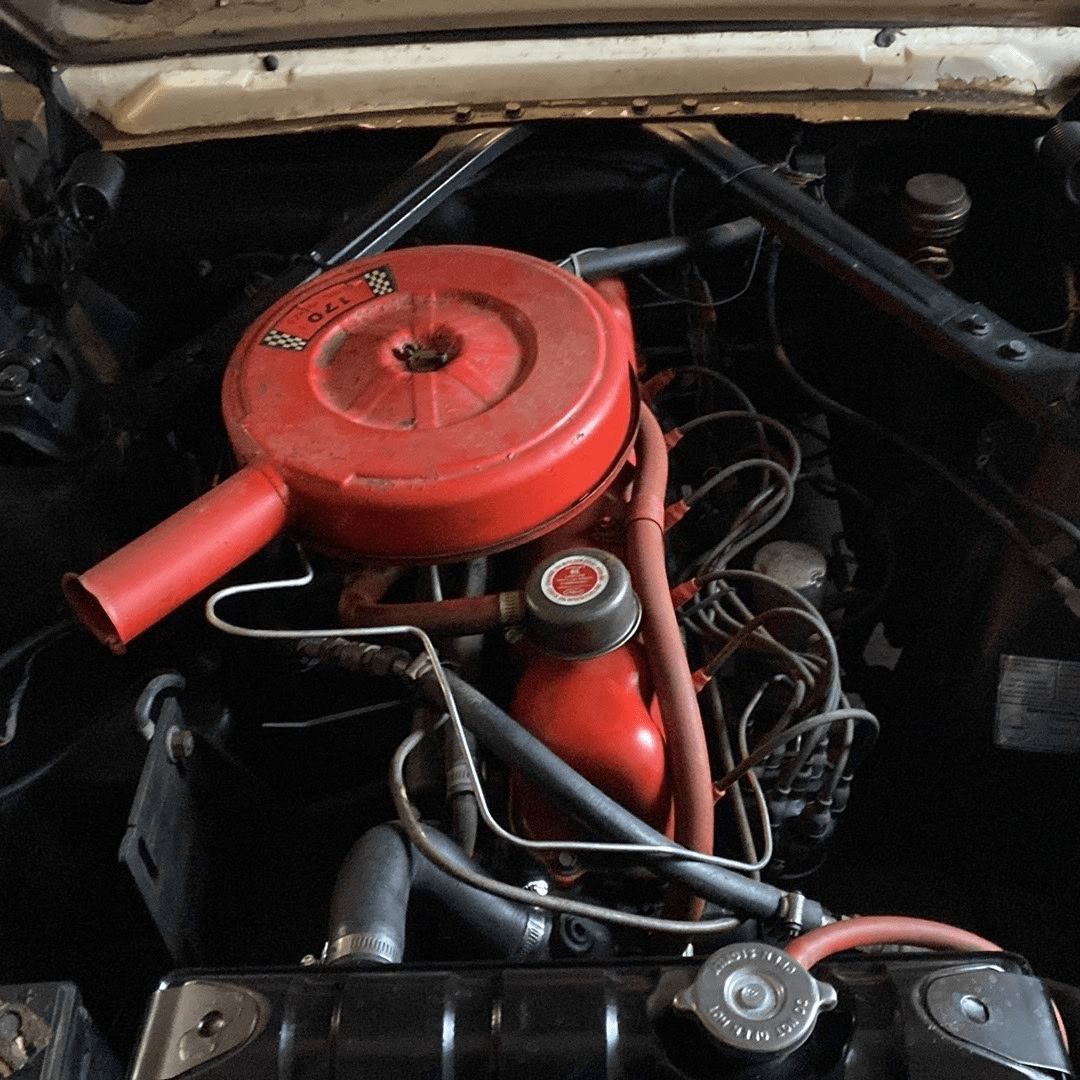 A picture containing red, engine, dirty

Description automatically generated
